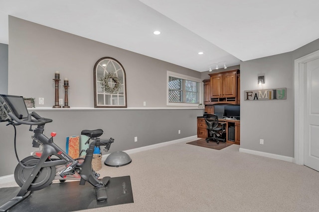 workout room featuring recessed lighting and baseboards