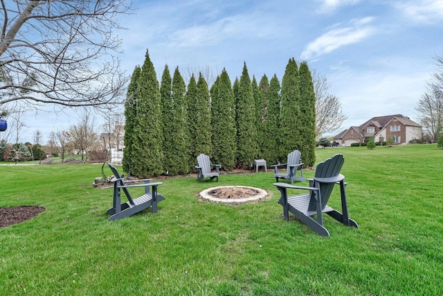 view of yard with a fire pit