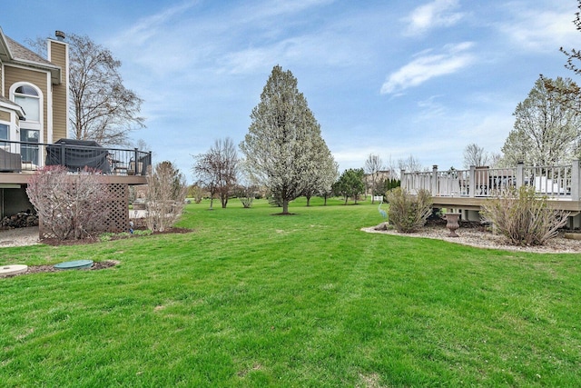 view of yard featuring a wooden deck