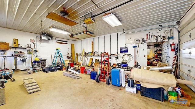 8400 Howe Rd, Wonder Lake, IL 60097 - garage with a workshop area and a garage door opener