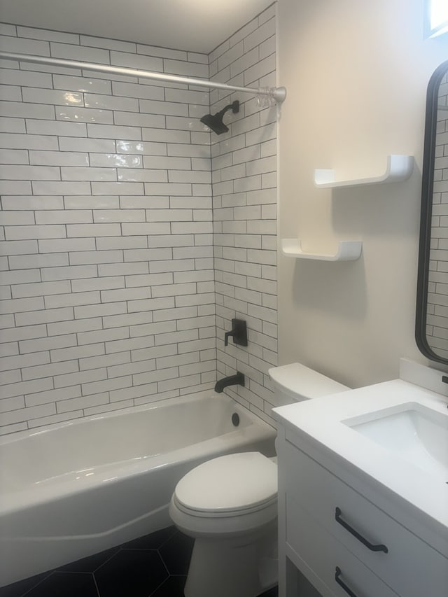 full bath with shower / washtub combination, vanity, toilet, and tile patterned floors