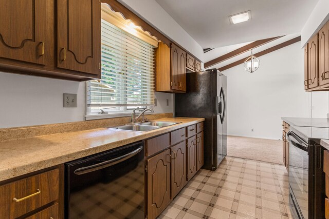 1204 Harrington Dr, Champaign, IL 61821 - kitchen with black appliances, light countertops, lofted ceiling, light flooring, and pendant lighting