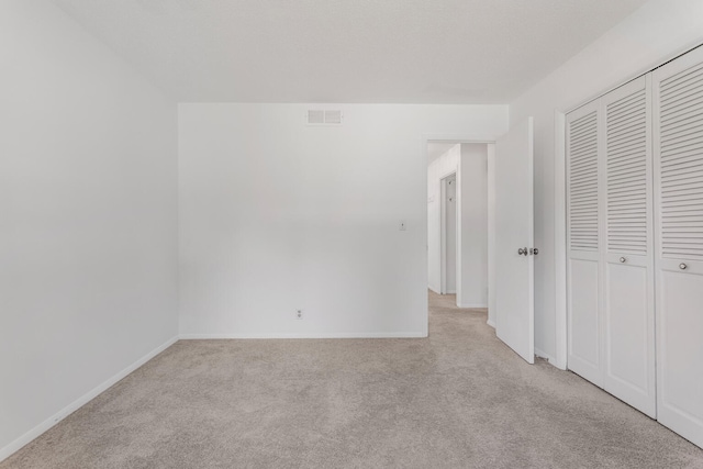 1204 Harrington Dr, Champaign, IL 61821 - unfurnished bedroom with light colored carpet and a closet