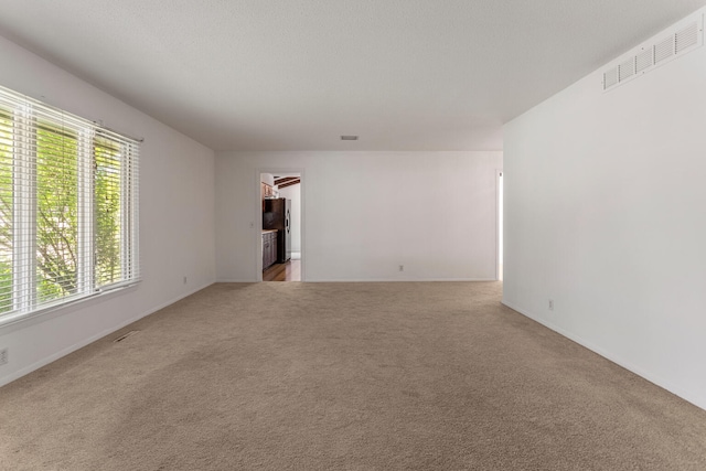 1204 Harrington Dr, Champaign, IL 61821 - unfurnished room with light colored carpet