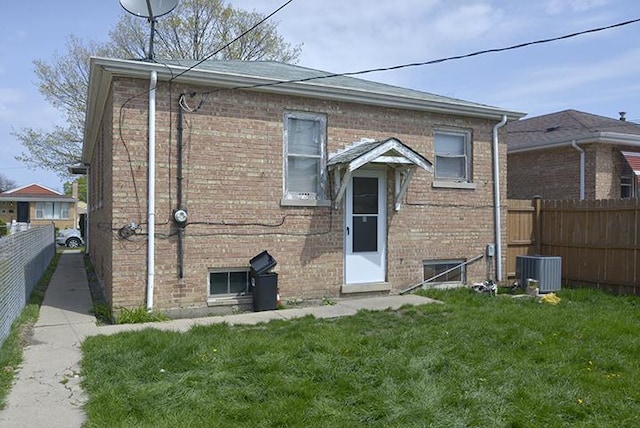 rear view of property featuring brick siding