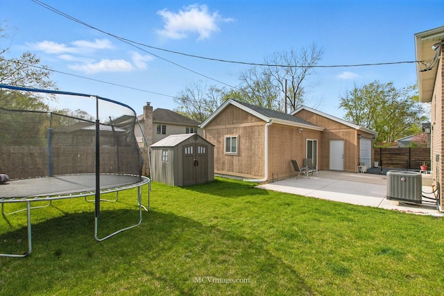 8566 S 83rd Ave, Hickory Hills, IL 60457 - view of yard featuring a patio, a trampoline, central air condition unit, an outdoor structure, and a shed