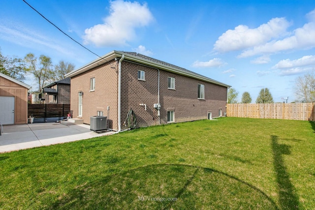 8566 S 83rd Ave, Hickory Hills, IL 60457 - back of property featuring a yard, a patio, brick siding, and fence