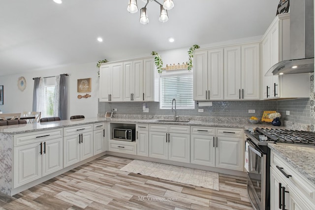8566 S 83rd Ave, Hickory Hills, IL 60457 - kitchen with a sink, a peninsula, stainless steel gas stove, wall chimney exhaust hood, and built in microwave