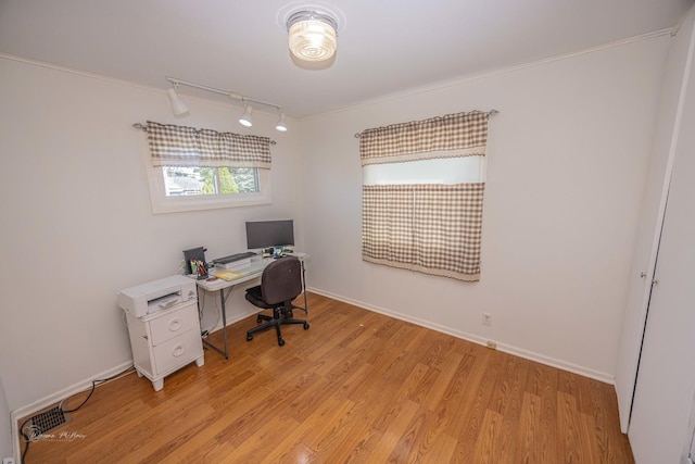 1315 Dellmar Ave, Joliet, IL 60435 - home office featuring light wood-style floors, track lighting, baseboards, and crown molding