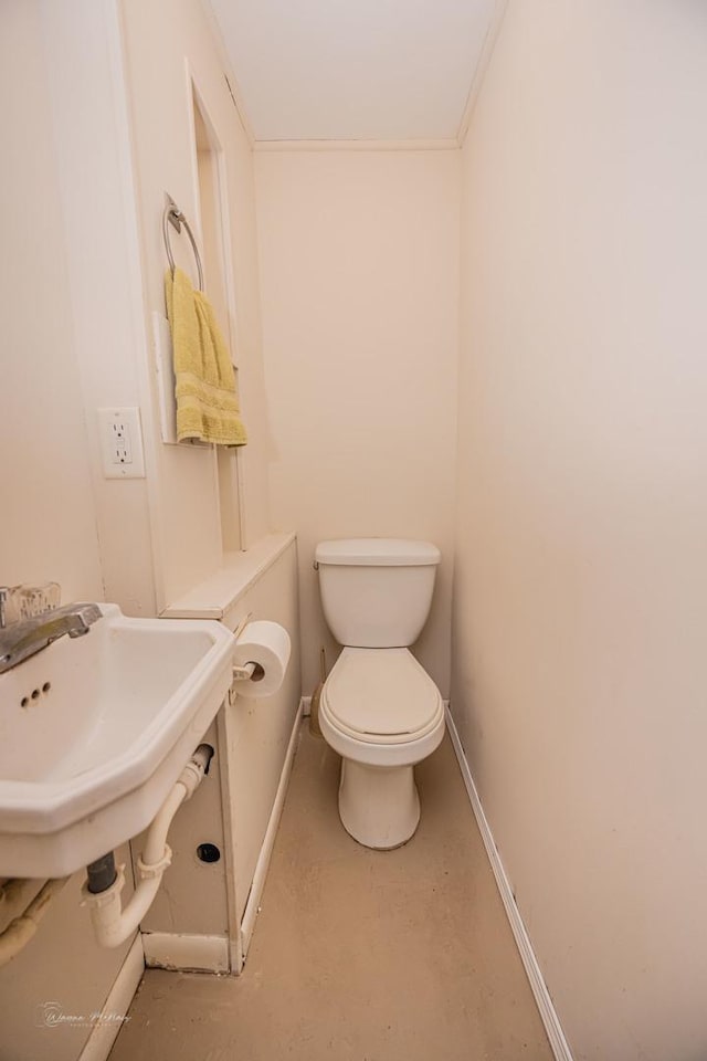 1315 Dellmar Ave, Joliet, IL 60435 - bathroom with baseboards, finished concrete flooring, and toilet