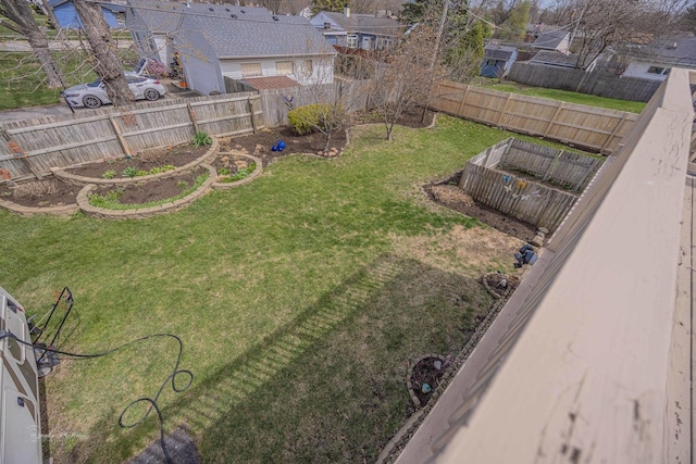 1315 Dellmar Ave, Joliet, IL 60435 - view of yard featuring a garage, a fenced backyard, and a residential view