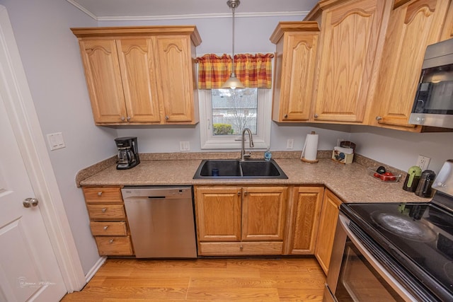 1315 Dellmar Ave, Joliet, IL 60435 - kitchen with crown molding, appliances with stainless steel finishes, a sink, light wood finished floors, and decorative light fixtures