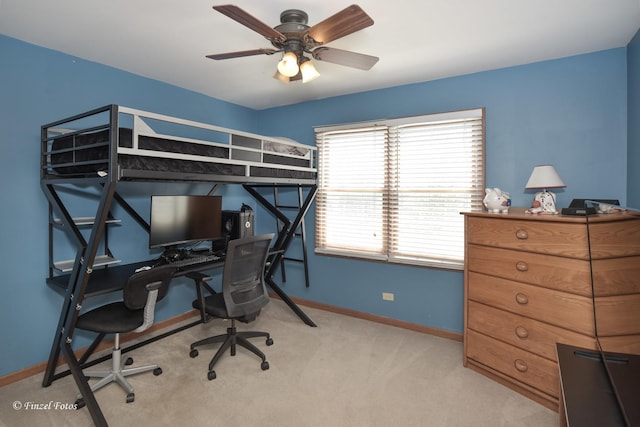 carpeted bedroom with baseboards and a ceiling fan