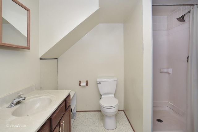 bathroom with toilet, walk in shower, and vanity