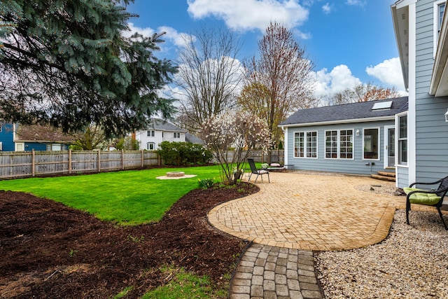 925 Appomattox Cir, Naperville, IL 60540 - view of yard featuring a patio, a fenced backyard, and an outdoor fire pit