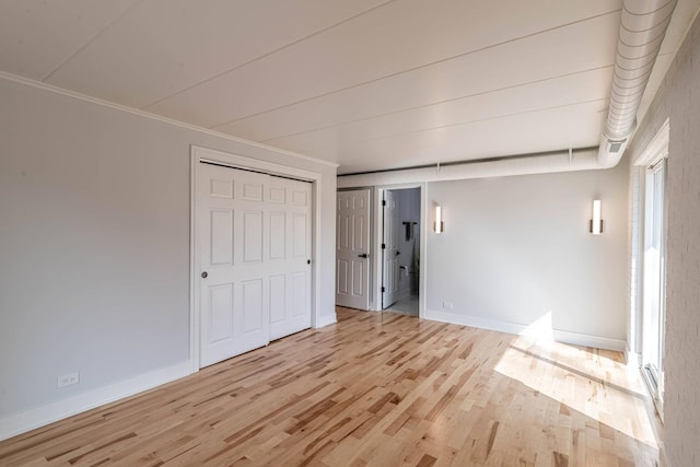 1022 Beau Brummel Dr, Sleepy Hollow, IL 60118 - unfurnished bedroom featuring baseboards, crown molding, and wood finished floors