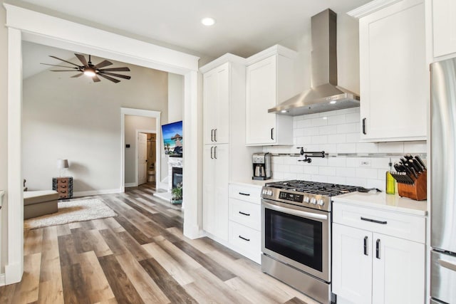 1461 S Candlestick Way, Waukegan, IL 60085 - kitchen featuring decorative backsplash, appliances with stainless steel finishes, light countertops, baseboards, and wall chimney exhaust hood