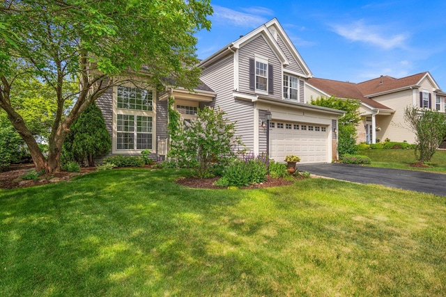 3 Spring Garden Ct, Lake In The Hills, IL 60156 - traditional-style house with driveway, an attached garage, and a front lawn