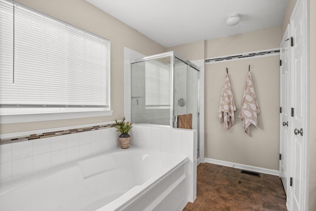 3 Spring Garden Ct, Lake In The Hills, IL 60156 - full bathroom featuring a bath, a shower stall, and baseboards