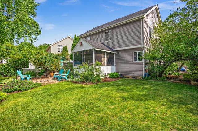 3 Spring Garden Ct, Lake In The Hills, IL 60156 - back of property with a sunroom, a yard, and a shingled roof