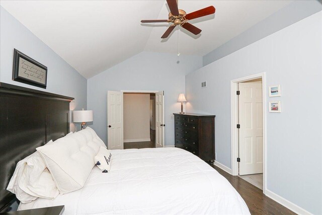 bedroom with visible vents, wood finished floors, lofted ceiling, baseboards, and ceiling fan