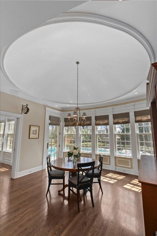 1300 Hackberry Ln, Winnetka, IL 60093 - dining space featuring ornamental molding, a chandelier, wood finished floors, plenty of natural light, and baseboards