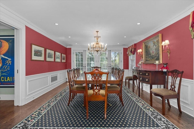 1300 Hackberry Ln, Winnetka, IL 60093 - dining space with a chandelier, wood finished floors, wainscoting, a decorative wall, and ornamental molding