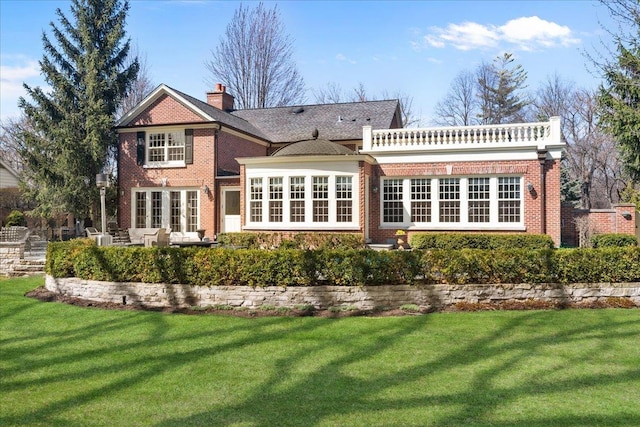 1300 Hackberry Ln, Winnetka, IL 60093 - rear view of house featuring brick siding, a chimney, and a yard