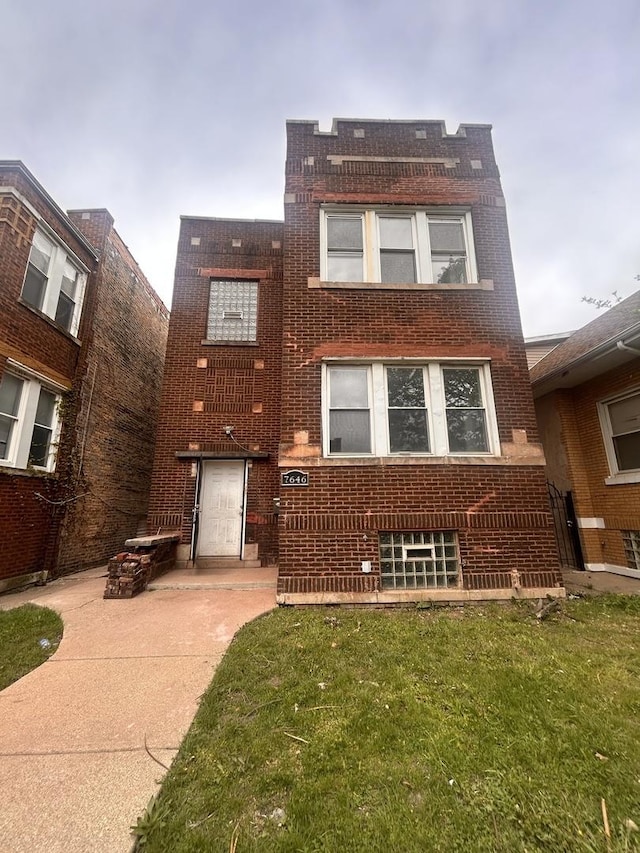 7646 S May St, Chicago, IL 60620 - view of front facade with brick siding and a front lawn