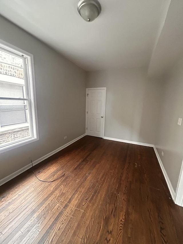 7646 S May St, Chicago, IL 60620 - spare room with baseboards and dark wood-style flooring
