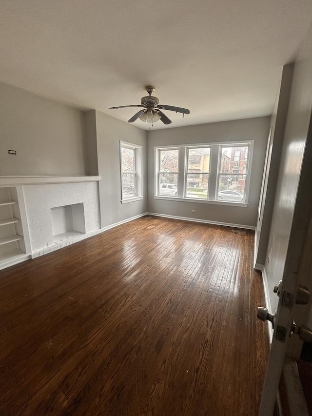 7646 S May St, Chicago, IL 60620 - unfurnished living room with baseboards, a ceiling fan, a fireplace, and hardwood / wood-style flooring