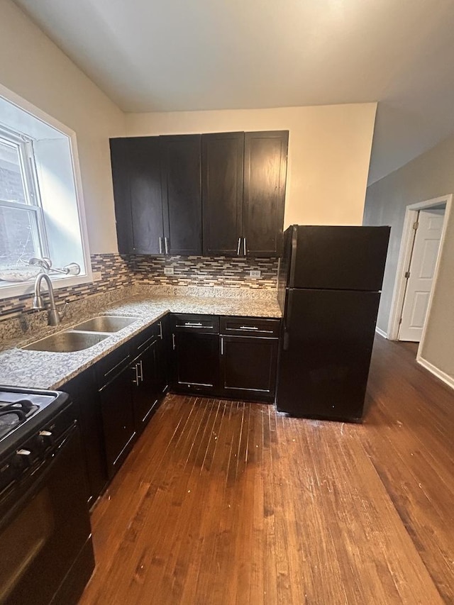 7646 S May St, Chicago, IL 60620 - kitchen featuring a sink, backsplash, black appliances, and dark wood-style floors