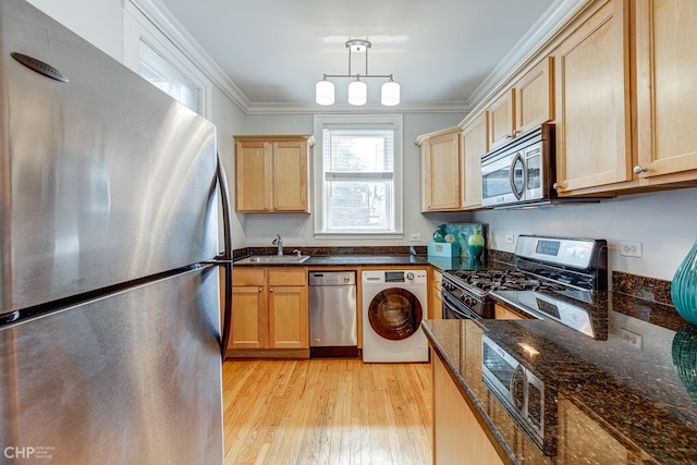 1949 W Argyle St Unit 1, Chicago, IL 60640 - kitchen featuring appliances with stainless steel finishes, washer / clothes dryer, light wood-type flooring, ornamental molding, and light brown cabinets