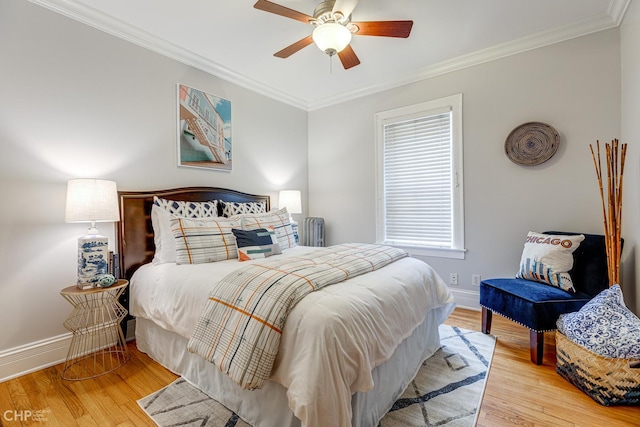 1949 W Argyle St Unit 1, Chicago, IL 60640 - bedroom featuring radiator heating unit, wood finished floors, ornamental molding, and a ceiling fan