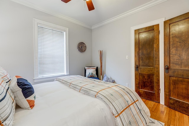 1949 W Argyle St Unit 1, Chicago, IL 60640 - bedroom with crown molding, light wood-style flooring, a ceiling fan, and multiple windows
