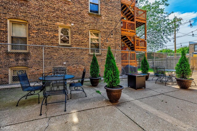 1949 W Argyle St Unit 1, Chicago, IL 60640 - view of patio with an outdoor fire pit and outdoor dining space