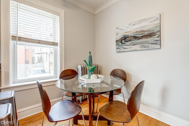 1949 W Argyle St Unit 1, Chicago, IL 60640 - dining room featuring ornamental molding, wood finished floors, and radiator