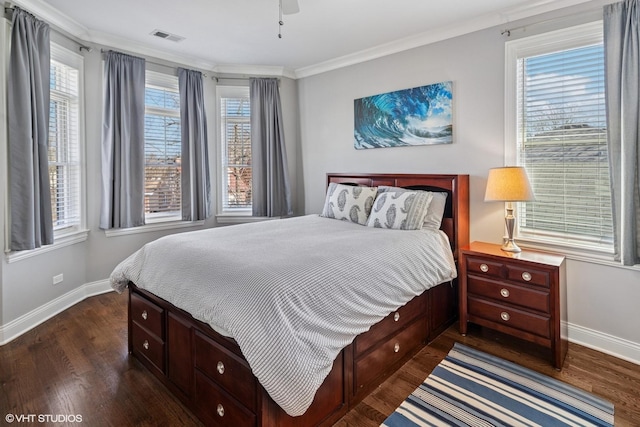 bedroom with ornamental molding, baseboards, dark wood-style flooring, and multiple windows