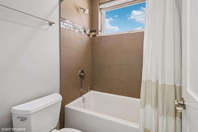 full bathroom with toilet and shower / bathtub combination with curtain