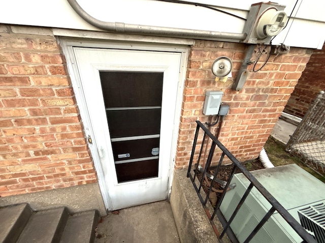 entrance to property with brick siding