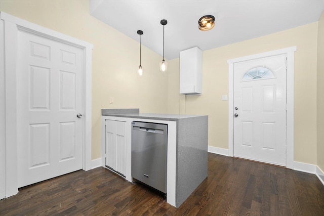 10617 S Wentworth Ave, Chicago, IL 60628 - kitchen with stainless steel dishwasher, dark wood-style flooring, white cabinets, a peninsula, and hanging light fixtures