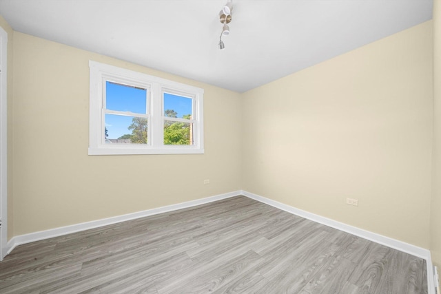 10617 S Wentworth Ave, Chicago, IL 60628 - unfurnished room with light wood finished floors and baseboards