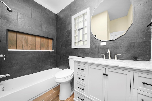 10617 S Wentworth Ave, Chicago, IL 60628 - full bathroom with vanity, shower / bathtub combination, and tile walls