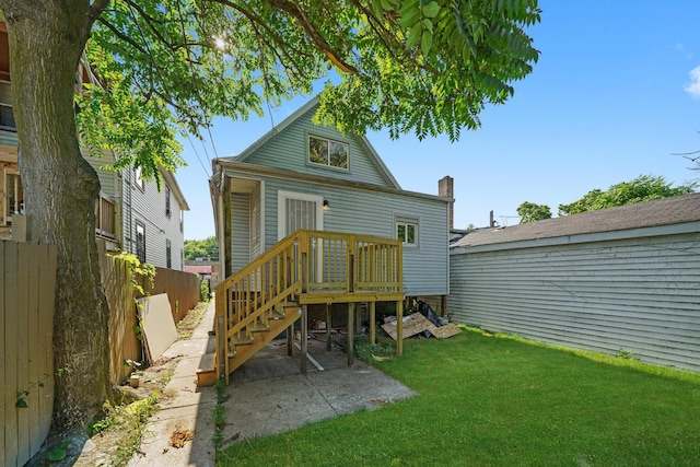 10617 S Wentworth Ave, Chicago, IL 60628 - back of property featuring a patio area and a chimney