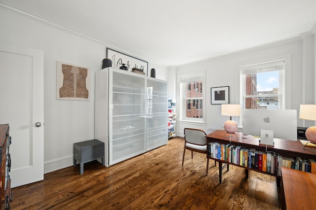 office space with baseboards, ornamental molding, and wood finished floors