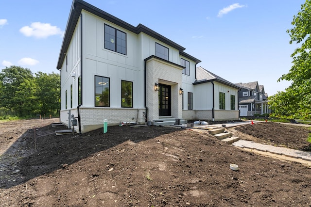 7213 Daybreak Ln, Long Grove, IL 60060 - modern farmhouse style home featuring board and batten siding and brick siding