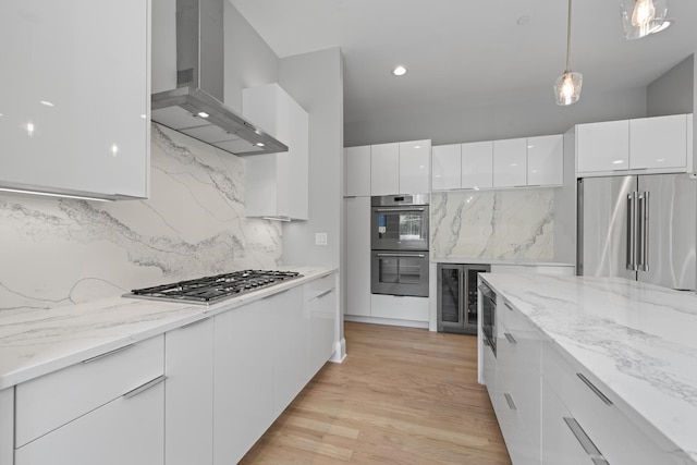 7213 Daybreak Ln, Long Grove, IL 60060 - kitchen featuring stainless steel appliances, wall chimney exhaust hood, modern cabinets, wine cooler, and white cabinetry
