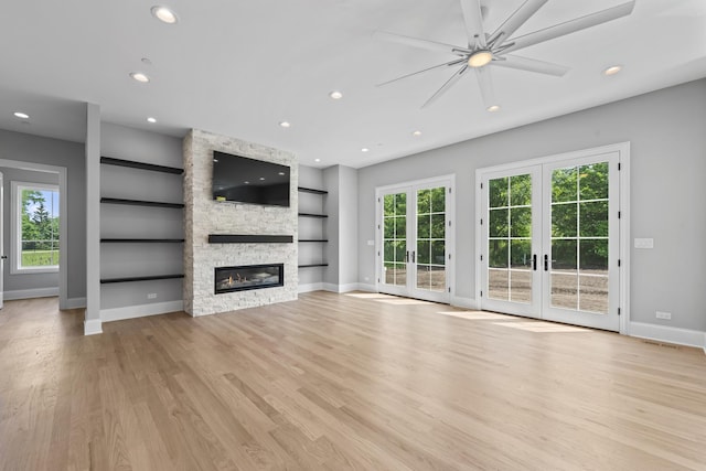 7213 Daybreak Ln, Long Grove, IL 60060 - unfurnished living room with recessed lighting, baseboards, built in features, a fireplace, and light wood-type flooring
