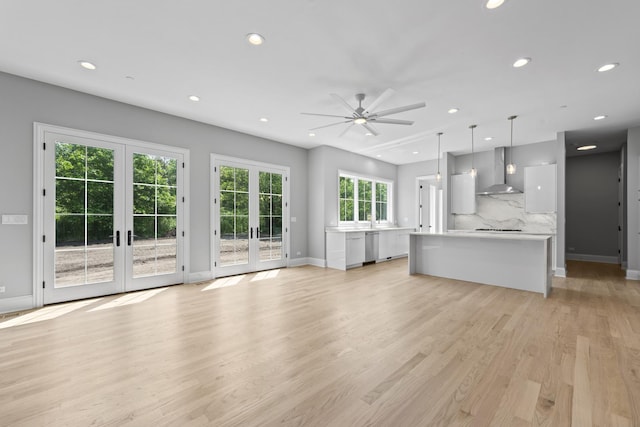 7213 Daybreak Ln, Long Grove, IL 60060 - unfurnished living room with french doors, recessed lighting, ceiling fan, baseboards, and light wood-style floors
