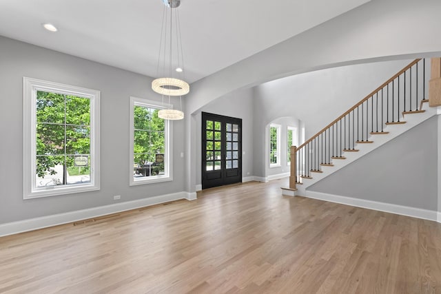 7213 Daybreak Ln, Long Grove, IL 60060 - foyer with light wood-type flooring, stairs, arched walkways, baseboards, and recessed lighting